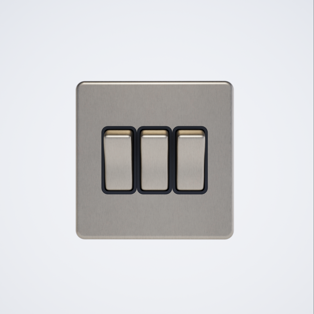 triple screwless light switch in brushed brass with black insert