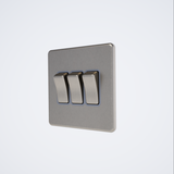 triple light switch in brushed steel with grey inserts