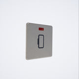 screwless 13A unswitched spur with neon in brushed steel with black inserts