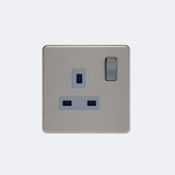 single screwless switches sockets in brushed steel with grey inserts